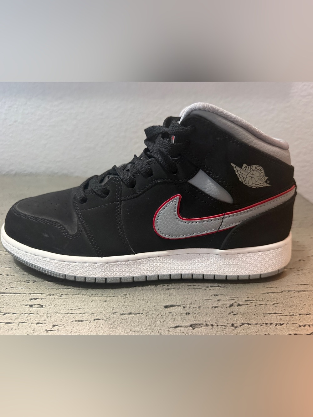 Jordan Kids Black Mid-Top Sneakers with Grey and Red Accents
